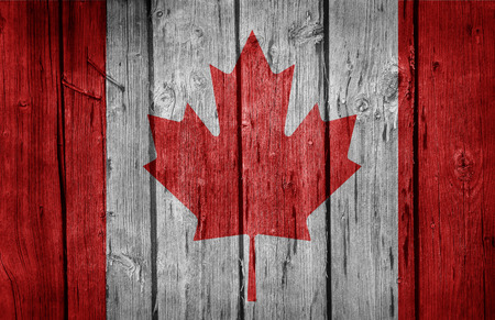 Canada flag on old wooden wallの写真素材