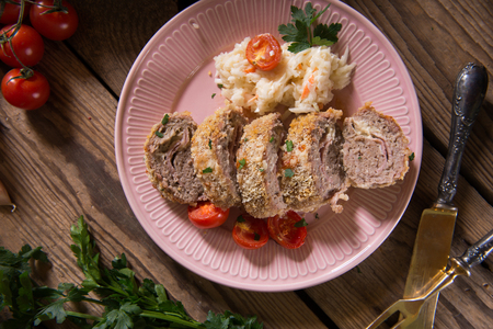 Meat roll stuffed with cheese and hamの写真素材
