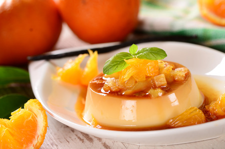 Italian dessert panna cotta with orange sauceの写真素材