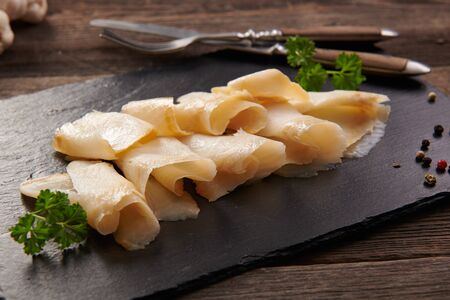 Delicious smoked halibut slices close upの写真素材