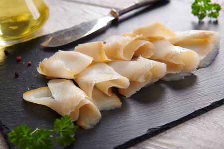 Delicious smoked halibut slices close upの写真素材