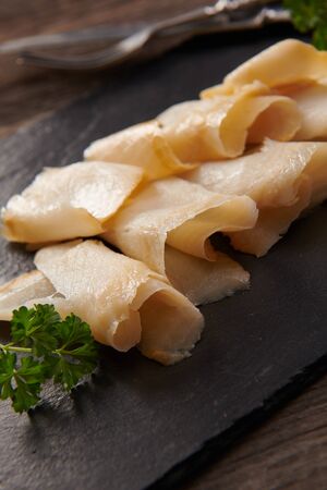 Delicious smoked halibut slices close upの写真素材