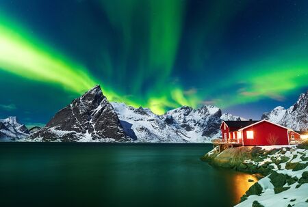 Aurora borealis over winter landscape - lofotens - Norwayの写真素材