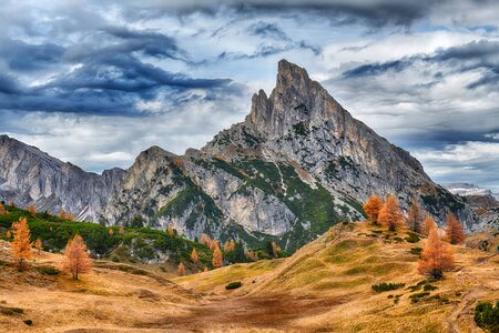 Autumn landscape of mountains over blue skyの写真素材