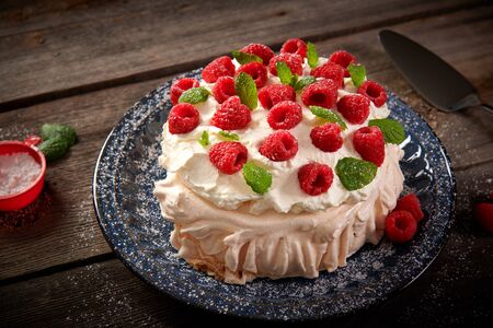 Merigue cake also called pavlova cake with fruitsの写真素材