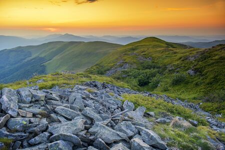 Beautiful summer sunset in the mountainsの写真素材
