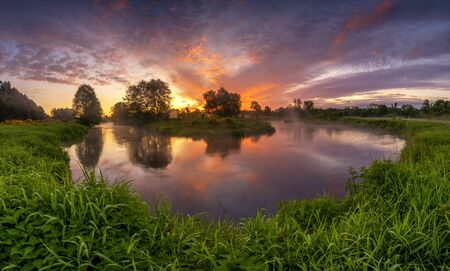 Beautiful sunrise over river banks - panoramaの写真素材