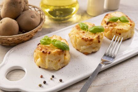 Small casseroles made from potatoes and cheeseの写真素材