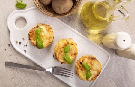 Small casseroles made from potatoes and cheeseの写真素材