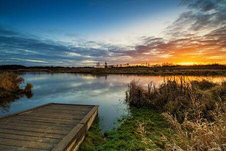 Beautiful sunrise over river banksの写真素材