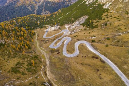 Drone aerial view - windy road in autumnの写真素材