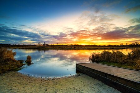 Beautiful sunrise over river banksの写真素材
