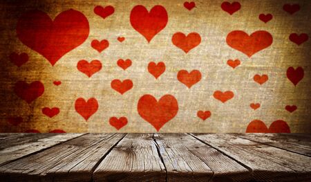 Empty old wooden table background with valentines day theme in backgroundの写真素材
