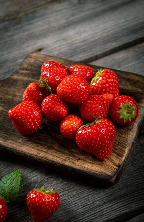 Fresh picked tasty strawberries on wooden backgroundの写真素材