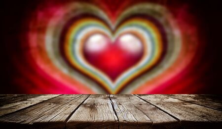 Empty old wooden table background with valentines day theme in backgroundの写真素材