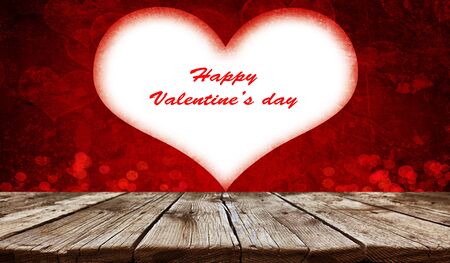 Empty old wooden table background with valentines day theme in backgroundの写真素材