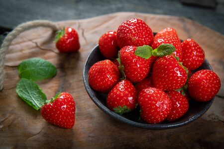 Fresh picked tasty strawberries on wooden background の写真素材