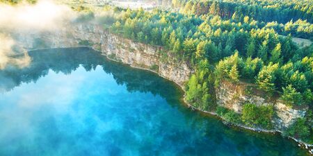 Aerial landscape from the drone - blue water and cliff