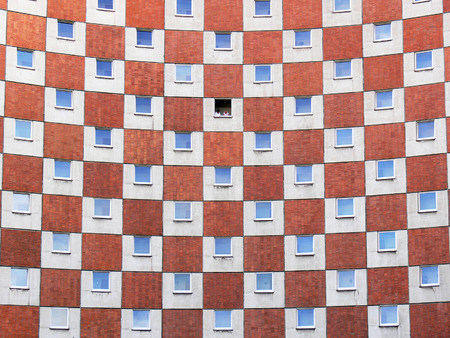 red, blue and white chessboard on the wall of the building with figuresのeditorial素材