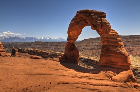 Delicate Arch with mountains in the background