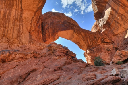High Dynamic Range Photo of a Double Arch against blue sky-  Moab Utahの写真素材