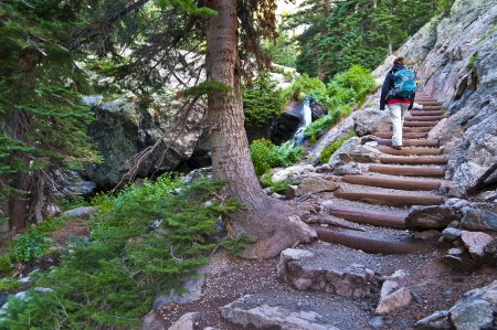 Girl Wearing Backpack on the trail leading towards Emerald Lake - Coloradoの写真素材