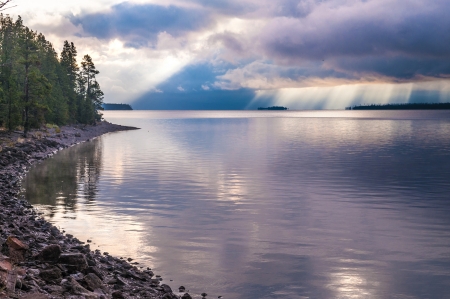 Rays of morning light illuminate Yellowstone Lakeの写真素材