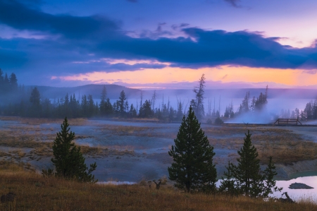 Beautiful Morning in West Thumb Geyser Basin with Yellowstone Lake in the bacgroundの写真素材