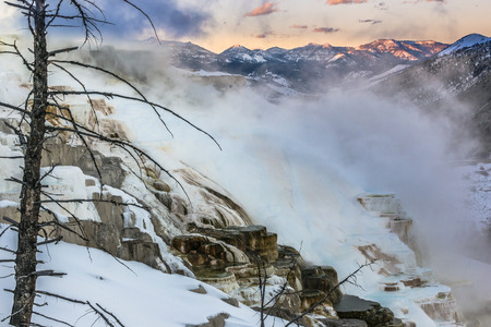 Beautiful Winter Geyser at Sunset - Yellowstone National Park の写真素材