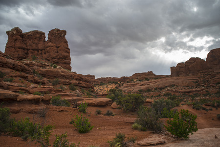Tower Arch Trail - Rock Formations with dramatic stormy sky の写真素材