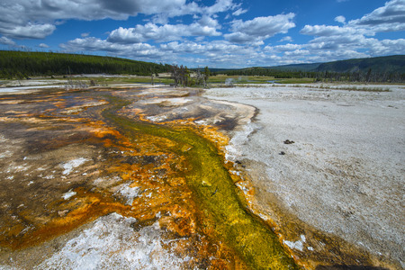 Colorful stream below the Sapphire Pool at the Biscuit Basin in Yellowstone National Park, Wyomingの写真素材