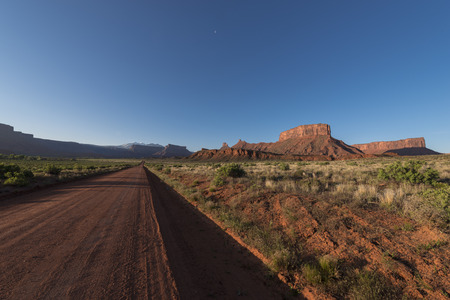 Dirt Road leading to the Mountains Utah Landscapes at Sunriseの写真素材
