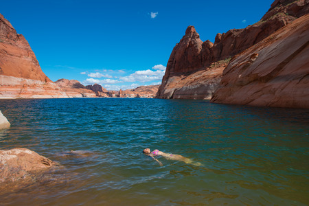 Bikini Woman taking a relaxing bath in the Lake Powell Horizontal Compositionの写真素材