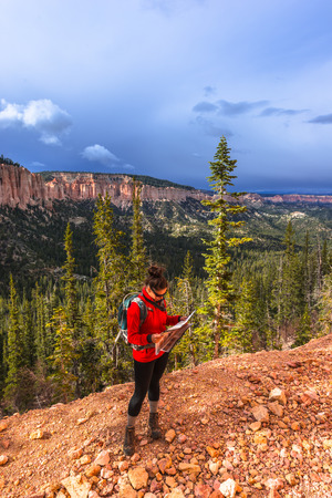 Woman Backpacker hiking down the Ponderosa Canyon Bryce National Parkの写真素材