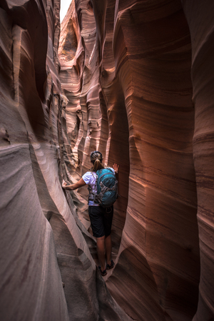 Backpacker Girl in Zebra Slot Canyon Escalante Utahの写真素材