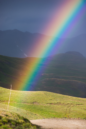 Beautiful Colorful rainbow over the Colorado Mountainsの写真素材