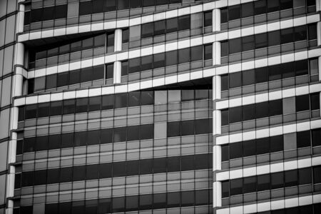 Black and white skyscraper wall surface close up. Commercial downtown design, Singaporeの写真素材