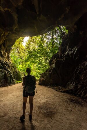 Dong Trung Trang Cave Vietnam Tourist backpacker exploring inside of a caveの写真素材