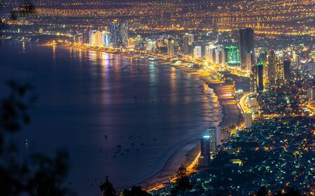 Da Nang City as seen from Ban Co Peak viewpoint at night, Vietnam.の写真素材