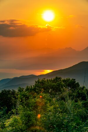 Beautiful sunset over The Da Nang Bay and Ba Na Hills as seen Ban Co Peak, Da Nang Vietanmの写真素材
