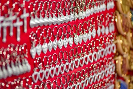 Keychains  jewelry  made of metal scraps from unexploded bombs Luang Prabang Market Laosの写真素材