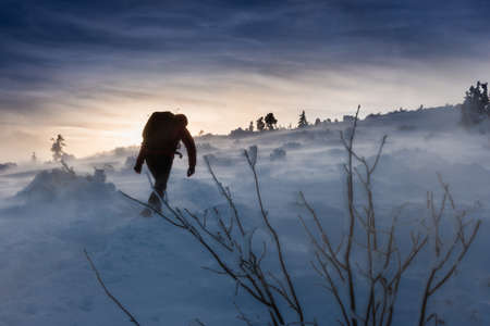 Backpacker woman on the Babia Gora Trail Winter Hiking Poland Beskidy Mountainsの写真素材