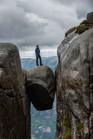 Kjeragbolten - boulder wedged in the mountain's crevasse 984 meter above the seaの写真素材