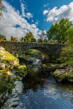 Arched stone bridge over Hauskeana, Hjelmeland, Norway.の写真素材