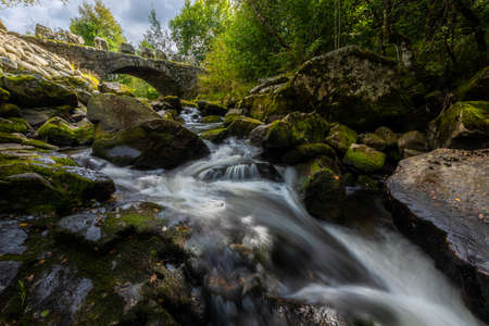 Arched stone bridge over Hauskeana, Hjelmeland, Norway.の写真素材