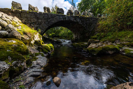 Arched stone bridge over Hauskeana, Hjelmeland, Norway.の写真素材