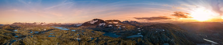 Jotunheimen: Majestic mountain range in central Norway, known for awe-inspiring peaks and alpine landscapes. Home to GaldhÃ¸piggen, Norway's highest peak at 2,469 meters. Glaciers, deep valleys, and hiking trails create a captivating playground for adventurers and nature enthusiasts in Norway's stunning wilderness.の写真素材