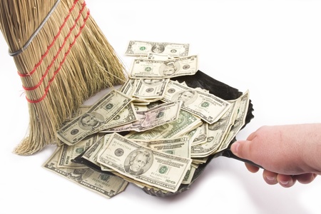 Sweeping up Money の写真素材