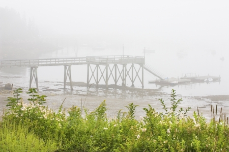 Fog and pier in Southwest Harbor Maine の写真素材