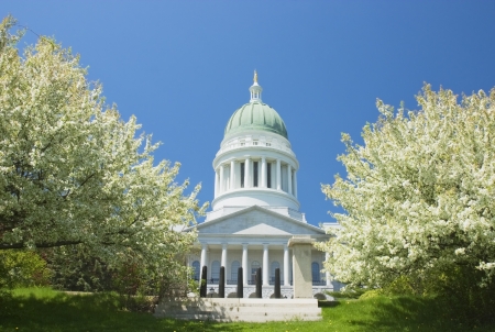 State capitol building and apple trees in Augusta Maine のeditorial素材